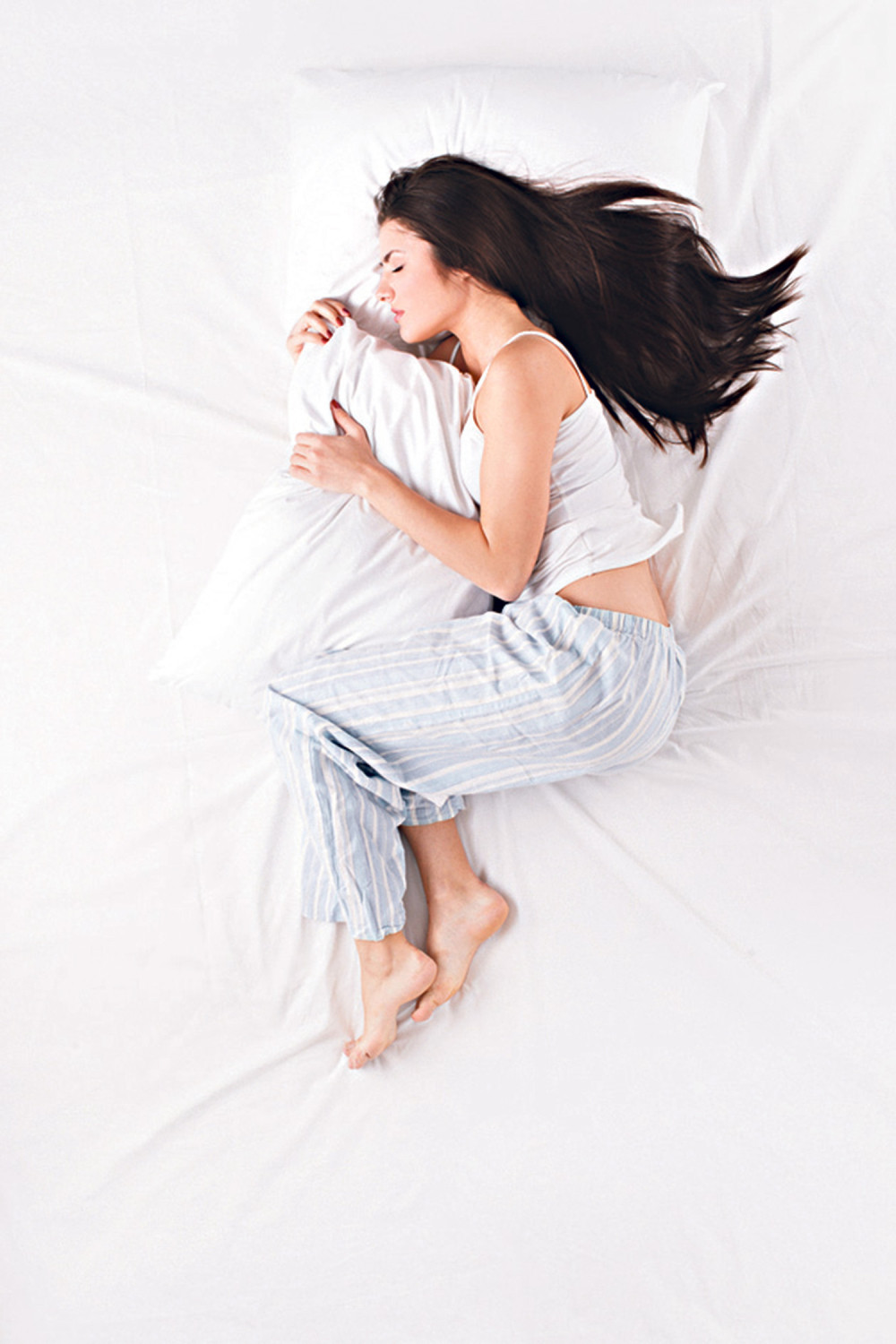 Držite jastuk između nogu!